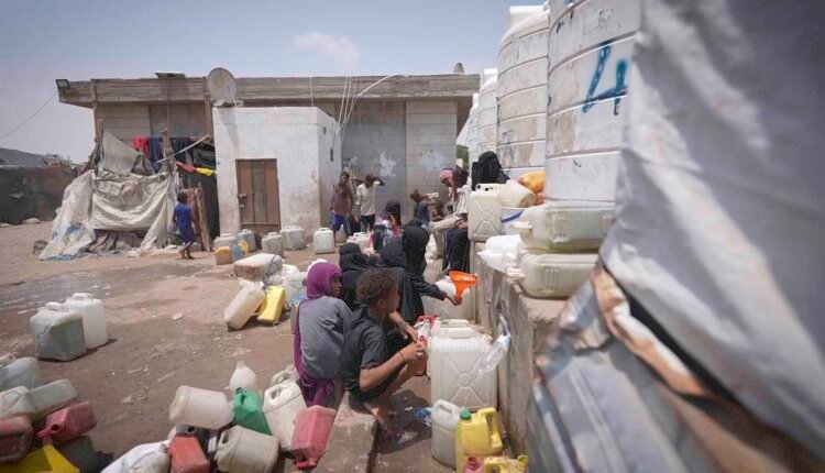 Displaced child at water point [2]