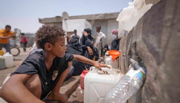 Displaced child at water point [3]