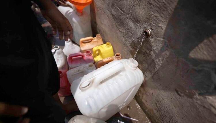 Displaced child at water point [4]