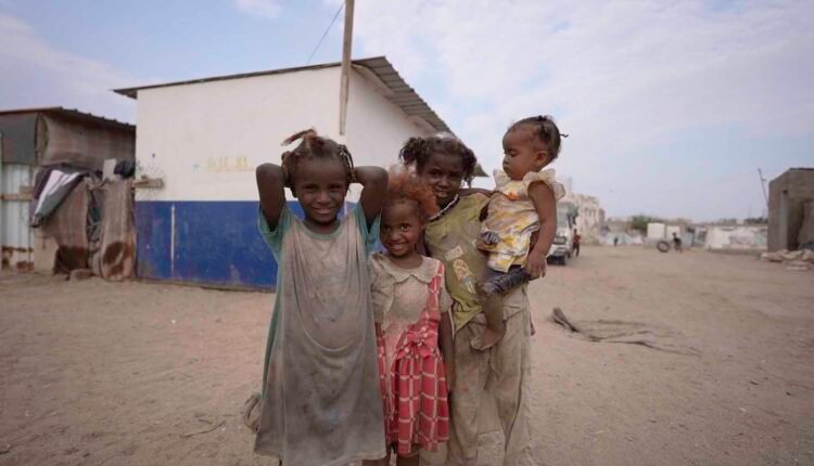 Young displaced children playing together [2]