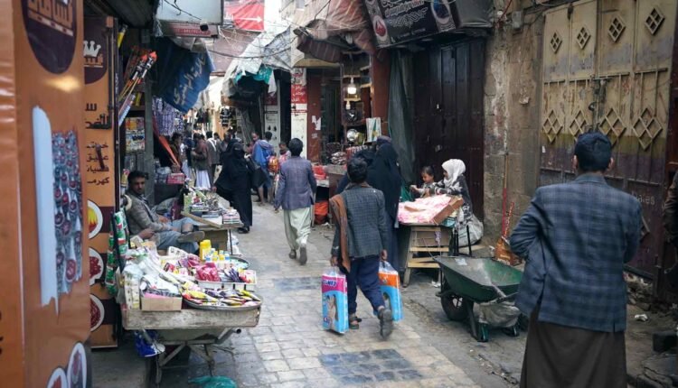 People walking in streets of Sana'a old City [2]