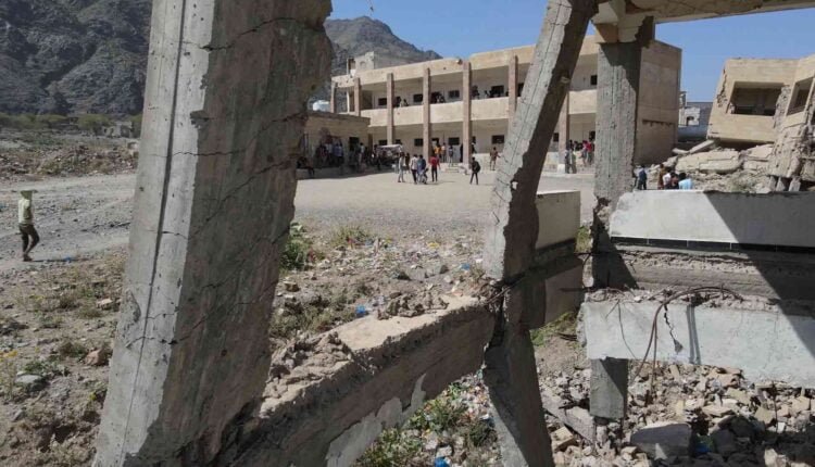 Playing football at the yard of a destroyed school [Drone] [2]