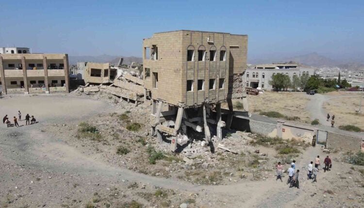 Playing football at the yard of a destroyed school [Drone] [3]
