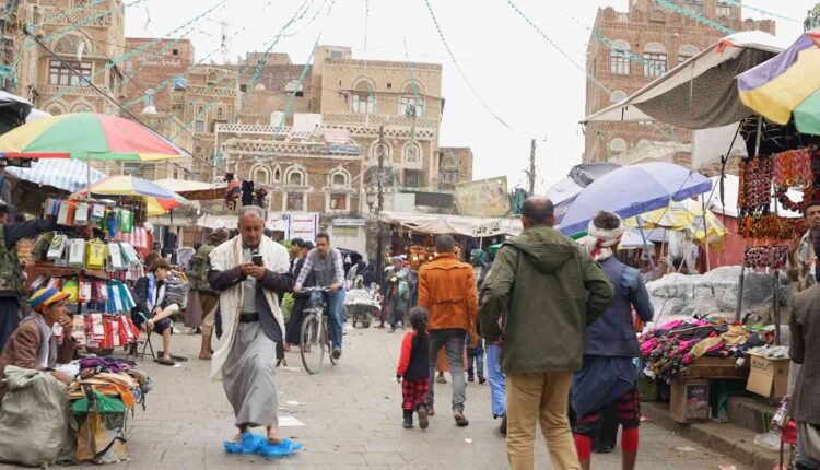 People walking in streets of Sana'a old City [3]