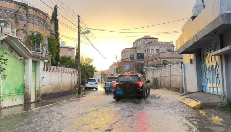 Cars passing by after heavy rain