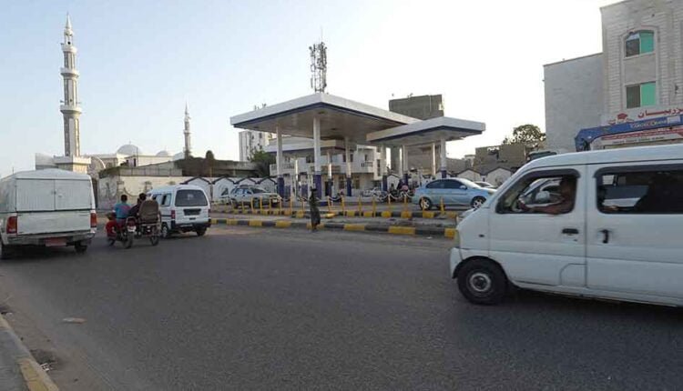 Cars passing by a filling station [5]