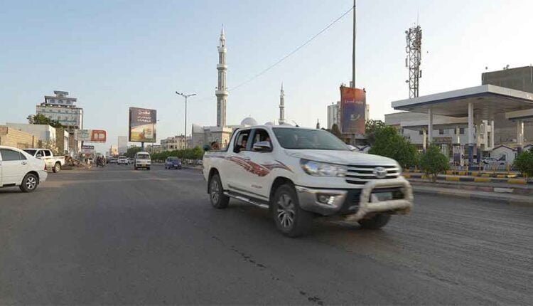 Cars passing in Al Mansoora district