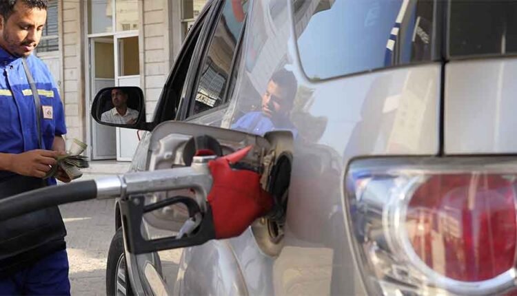 Filling a car with petrol and getting paid