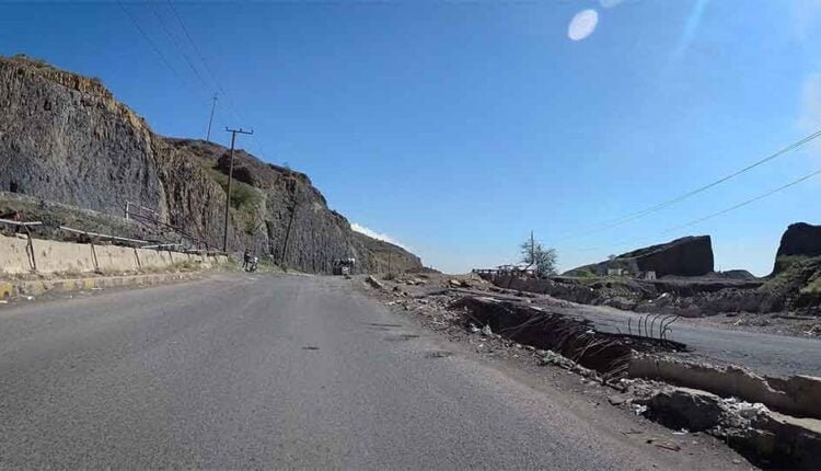 Driving beside rocked affected road