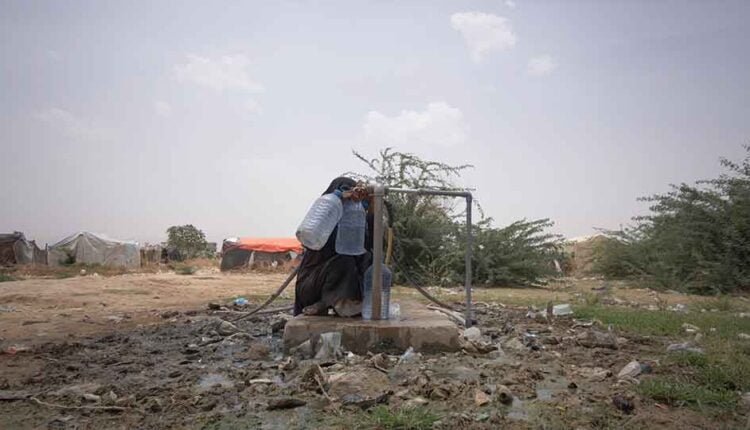 Woman fetching water