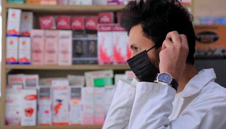 Wearing a mask inside a pharmacy [2]