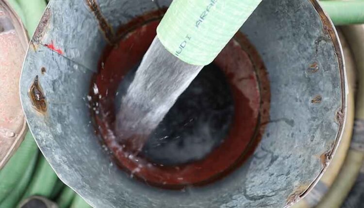 Filling up a water tank truck